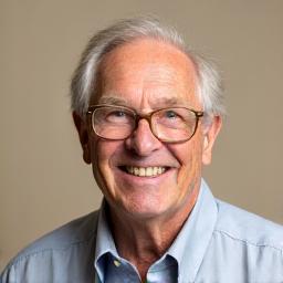 Headshot of David, a cheerful senior man.